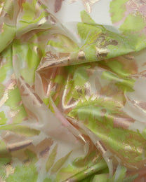 Close-up of green and beige fabric with floral patterns