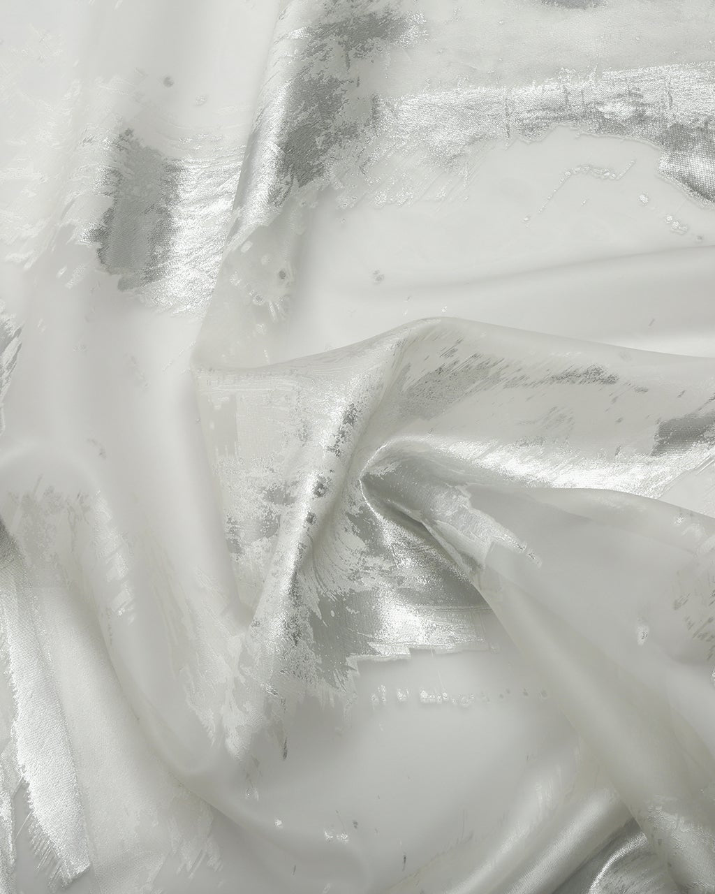 Close-up of silver metallic fabric texture